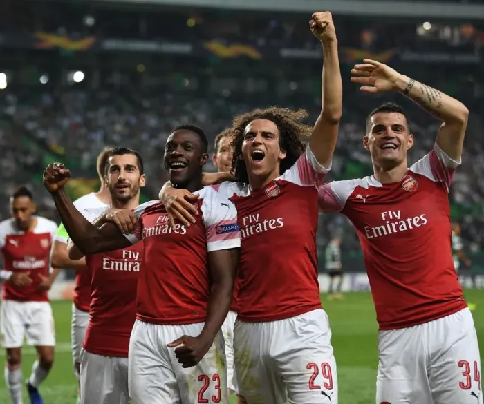 Framed Print : Arsenal's Triumph: Welbeck, Guendouzi, and Xhaka Celebrate Goal against Sporting Lisbon (2018-19) Framed Print : Arsenal's Triumph: Welbeck, Guendouzi, and Xhaka Celebrate Goal against Sporting Lisbon (2018-19)