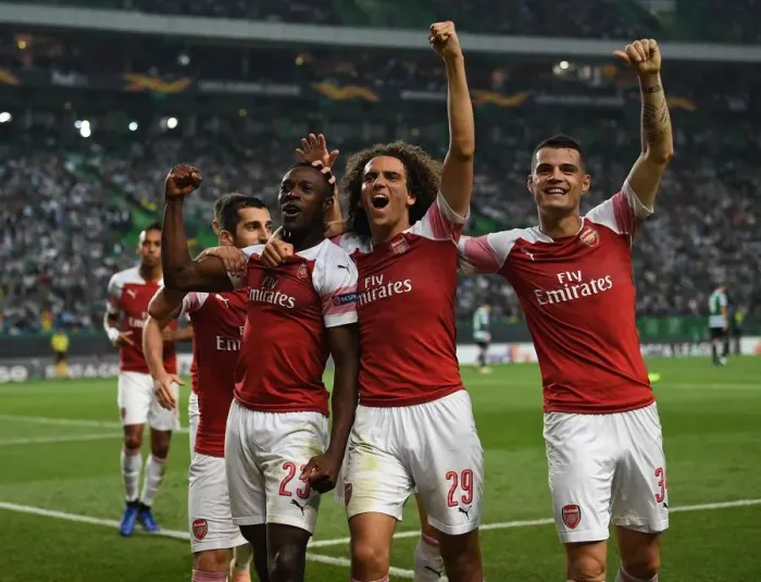Framed Print : Arsenal's Triumph: Welbeck, Guendouzi, and Xhaka's Unforgettable Goal Celebration (vs. Sporting Lisbon, 2018)