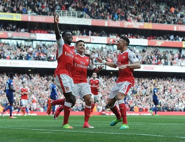 Arsenal's Triumph: Welbeck, Sanchez, and Gibbs Celebrate Goals Against Manchester United (2016-17)