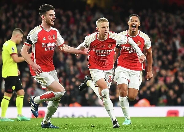 Arsenal's Triumph: Zinchenko, Rice, and Saliba's Euphoric Celebration After Scoring the Third Goal vs. Burnley (2023-24)