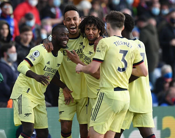 Arsenal's Triumphant Celebration: Pepe, Aubameyang, and Tierney's Jubilant Reaction After Scoring Against Crystal Palace (2020-21)