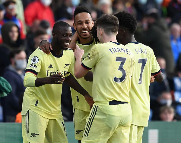 Arsenal's Triumphant Moment: Pepe, Aubameyang, and Tierney's Jubilant Celebration (2020-21)