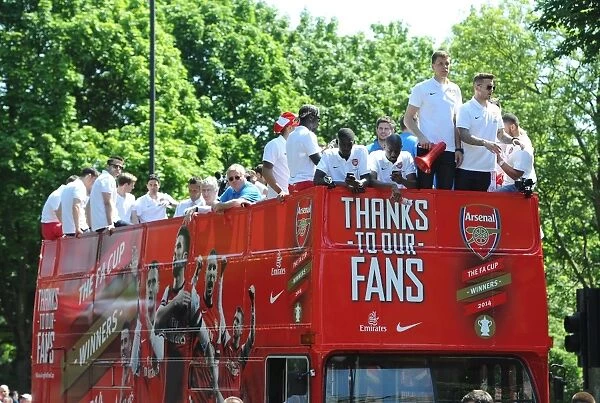 Arsenal's Triumphant Parade with the 2014 Trophy in Islington