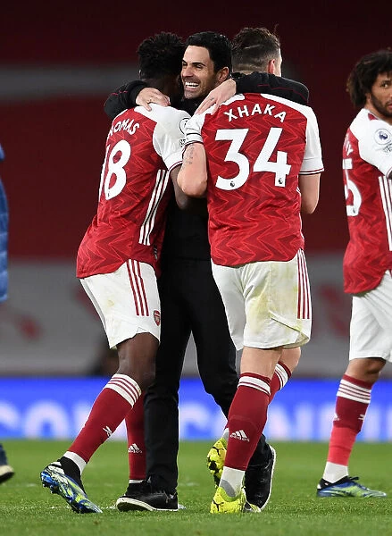 Arsenal's Triumphant Threesome: Arteta, Partey, and Xhaka Celebrate Premier League Victory over Tottenham