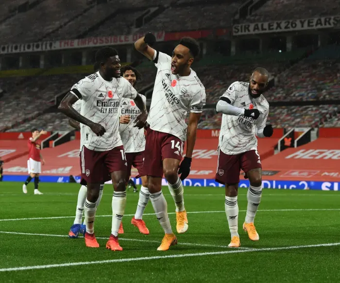 Framed Print : Arsenal's Triumphant Trio: Aubameyang, Partey, Lacazette - Celebrating a Goal at Manchester United (2020-21) Framed Print : Arsenal's Triumphant Trio: Aubameyang, Partey, Lacazette - Celebrating a Goal at Manchester United (2020-21)