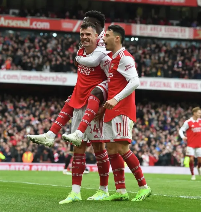 Framed Print : Arsenal's Triumphant Trio: Xhaka, Saka, and Martinelli's Euphoric Goal Celebration (2022-23): A Peak at Arsenal FC's Exhilarating Victory over Leeds United