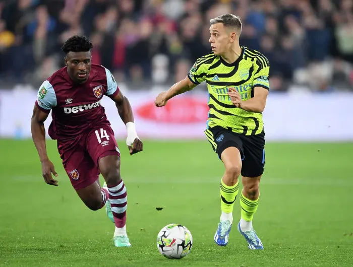 Framed Print : Arsenal's Trossard Battles Past West Ham's Kudus in Carabao Cup Clash