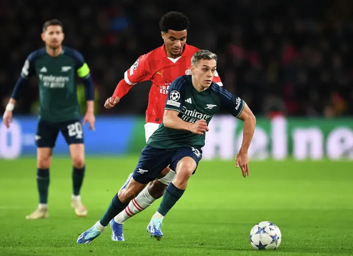 Framed Print : Arsenal's Trossard Clashes with PSV's Tillman in Champions League Battle Framed Print : Arsenal's Trossard Clashes with PSV's Tillman in Champions League Battle
