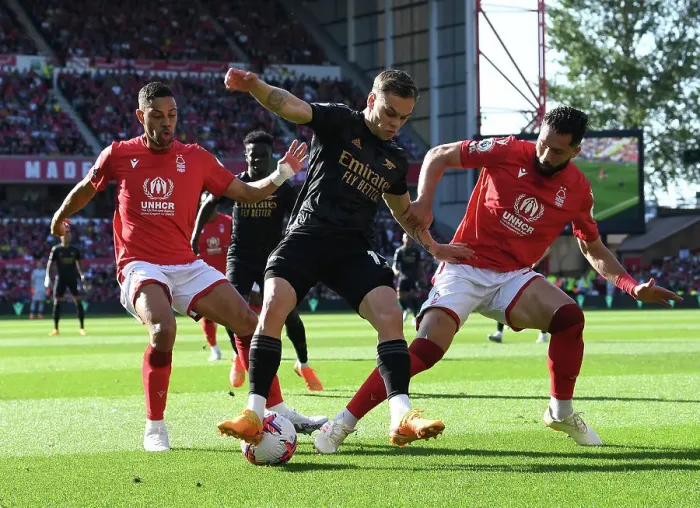 Framed Print : Arsenal's Trossard Faces Off Against Forest's Defense in Premier League Clash