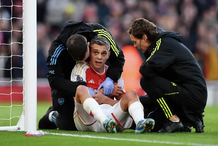 Framed Print : Arsenal's Trossard Scores First Goal, Receives Treatment in Arsenal v Burnley Premier League Clash (2023-24)