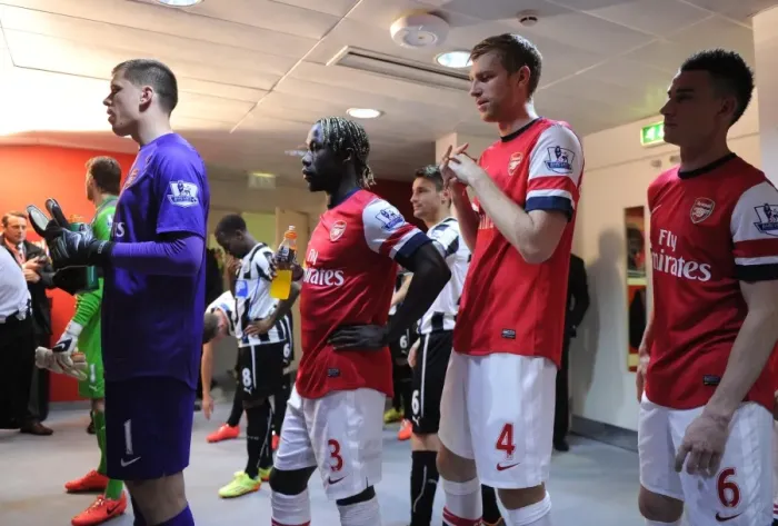 Framed Print : Arsenal's Unbeatable Defense: Szczesny, Sagna, Mertesacker, and Koscielny Secure 2:0 Victory Over Newcastle