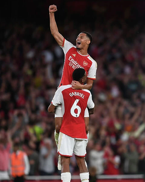 Arsenal's Unbeatable Duo: Saliba and Magalhaes Celebrate Victory Over Manchester City (2023-24)