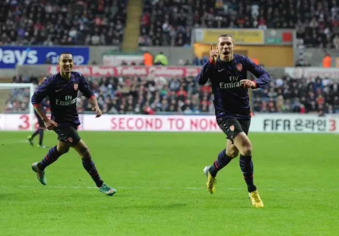 Framed Print : Arsenal's Unforgettable FA Cup Goal Celebration: Podolski and Walcott's Emotional Moment at Swansea
