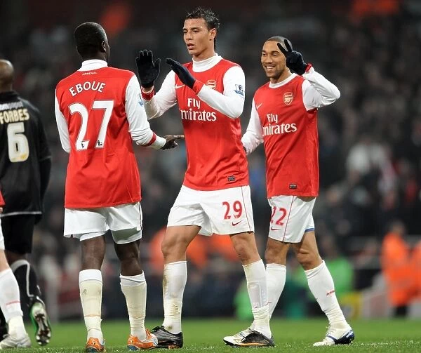 Arsenal's Unforgettable FA Cup Victory: Clichy, Eboue, and Chamakh Celebrate a 5-0 Thrashing of Leyton Orient