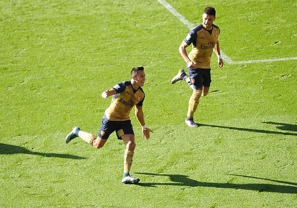 Arsenal's Unforgettable Goal Celebration: Sanchez and Oxlade-Chamberlain's Moment of Triumph Against Leicester City (2015 / 16)