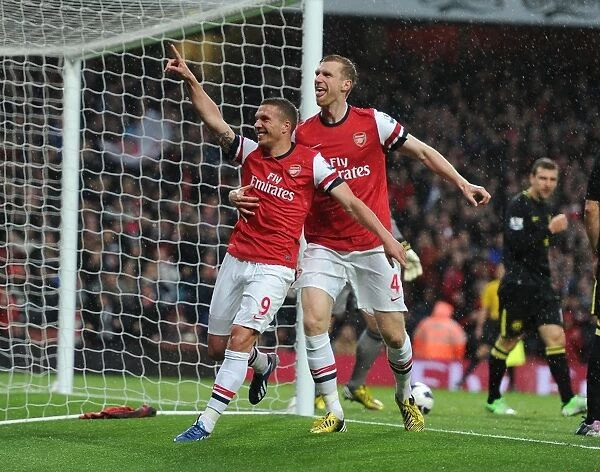 Arsenal's Unforgettable Goal Celebration: Podolski and Mertesacker's Emotional Moment (Arsenal vs Wigan Athletic, 2013)
