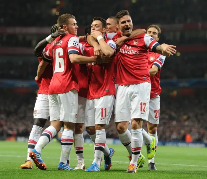 Framed Print : Arsenal's Unforgettable Goal Celebration: Ozil, Sagna, Ramsey, Gibbs, Flamini, Giroud (vs. Napoli, 2013-14)