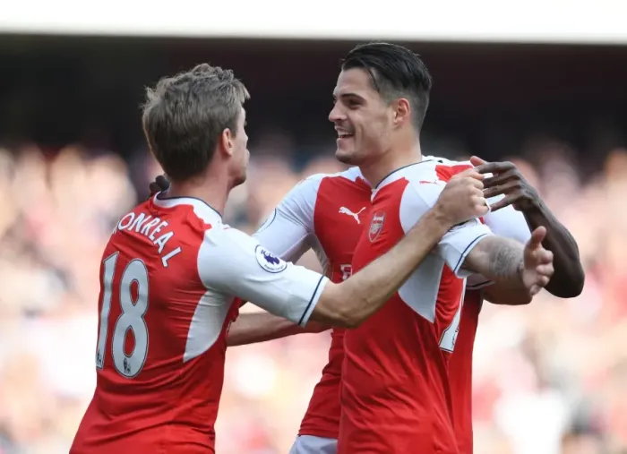Framed Print : Arsenal's Unforgettable Goal Celebration: Xhaka and Monreal's Emotional Moment vs. Manchester United (2016-17)