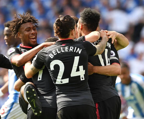 Arsenal's Unforgettable Moment: Aubameyang, Iwobi, and Bellerin Celebrate Goal vs. Huddersfield (2017-18)