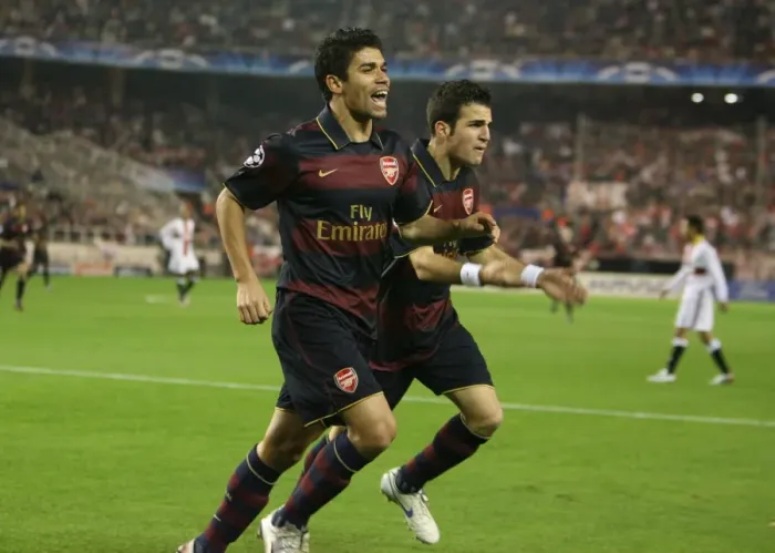 Framed Print : Arsenal's Unforgettable Triumph: Eduardo and Fabregas's Goal Celebration in Seville, UEFA Champions League (3:1)