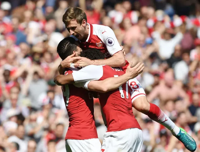 Framed Print : Arsenal's Unforgettable Triumph: Monreal, Xhaka, Iwobi's Euphoric Celebration vs. West Ham United (2017-18)