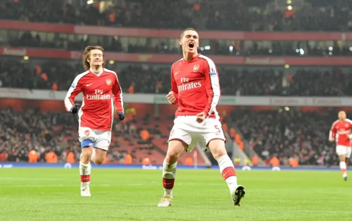 Framed Print : Arsenal's Unforgettable Triumph: Vermaelen and Rosicky's Goal Celebration (4:2) vs. Bolton Wanderers, 2010