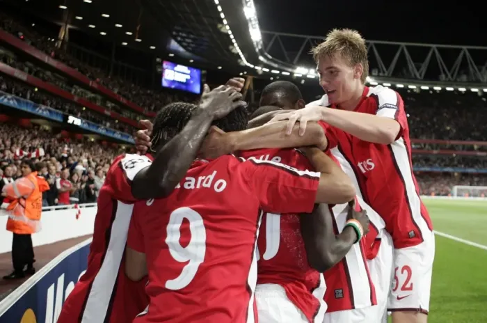 Framed Print : Arsenal's Unforgettable Victory: Emmanuel Eboue's Exultant Moment after Scoring the Decisive Goal vs Celtic in the UEFA Champions League (2009)