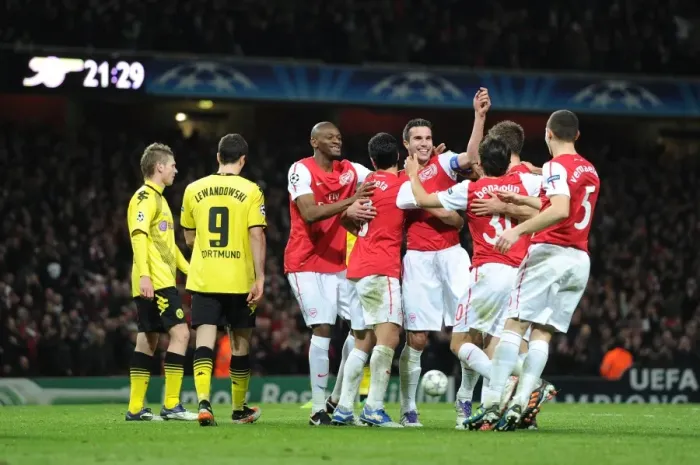 Framed Print : Arsenal's Unforgettable Victory: Robin van Persie's Double Strikes Borussia Dortmund in the Champions League Framed Print : Arsenal's Unforgettable Victory: Robin van Persie's Double Strikes Borussia Dortmund in the Champions League