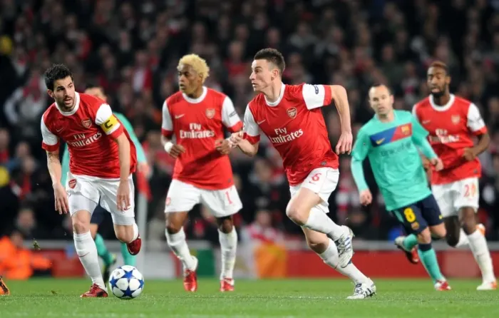 Framed Print : Arsenal's Unforgettable Victory: Koscielny and Fabregas Lead the Way vs. Barcelona in the UEFA Champions League