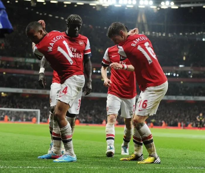 Framed Print : Arsenal's Unforgettable Victory: Ramsey and Walcott's Goal Celebration vs. Wigan Athletic (2012-13)