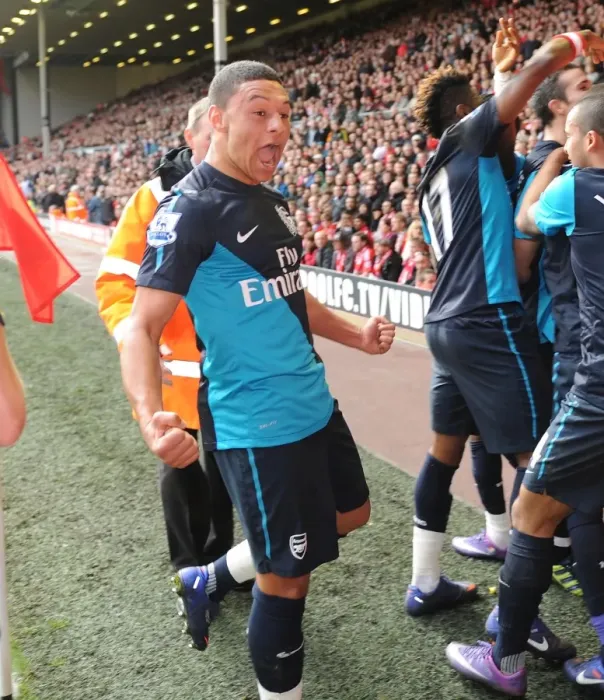 Framed Print : Arsenal's Unforgettable Victory: Van Persie's Double Strike vs. Liverpool (2012) - Oxlade-Chamberlain's Emotional Celebration