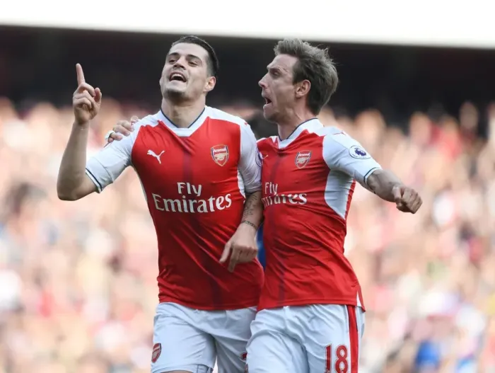 Framed Print : Arsenal's Unforgettable Victory: Xhaka and Monreal's Goal Celebration vs Manchester United (2016-17)
