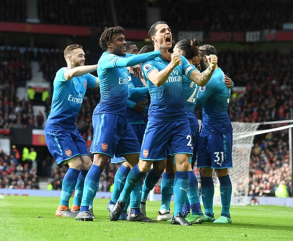 Arsenal's Unforgettable Win: Xhaka, Iwobi, Chambers, and Mkhitaryan Celebrate Goal at Old Trafford (2017-18)