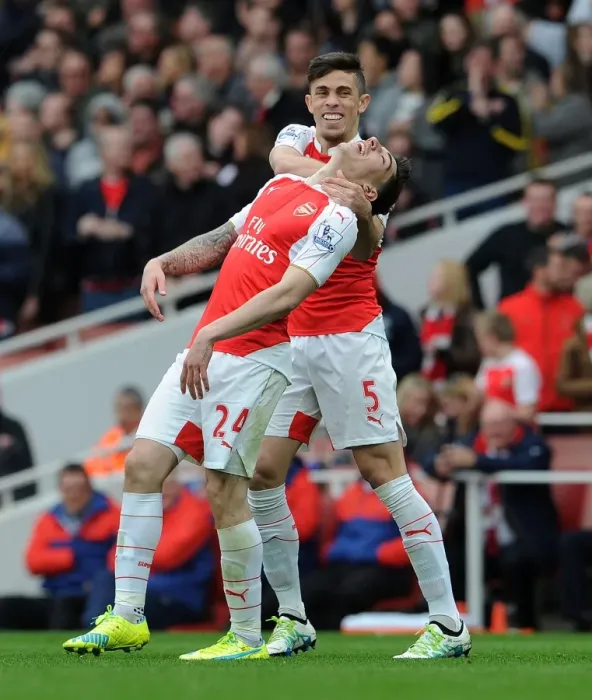 Framed Print : Arsenal's Unstoppable Duo: Bellerin and Gabriel's Goal Celebration vs. Watford (2015-16)