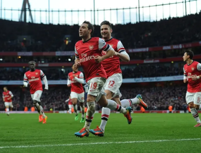 Framed Print : Arsenal's Unstoppable Duo: Cazorla and Giroud's Electric Goal Dance (2013-14)