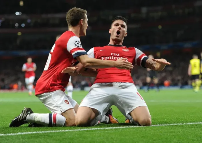 Framed Print : Arsenal's Unstoppable Duo: Giroud and Ramsey in Glory - Goal Celebration vs Borussia Dortmund, 2013-14 UEFA Champions League