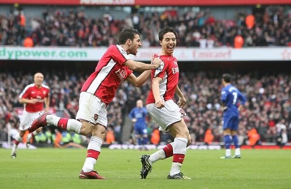 Arsenal's Unstoppable Duo: Nasri and Fabregas Celebrate Victory Over Manchester United