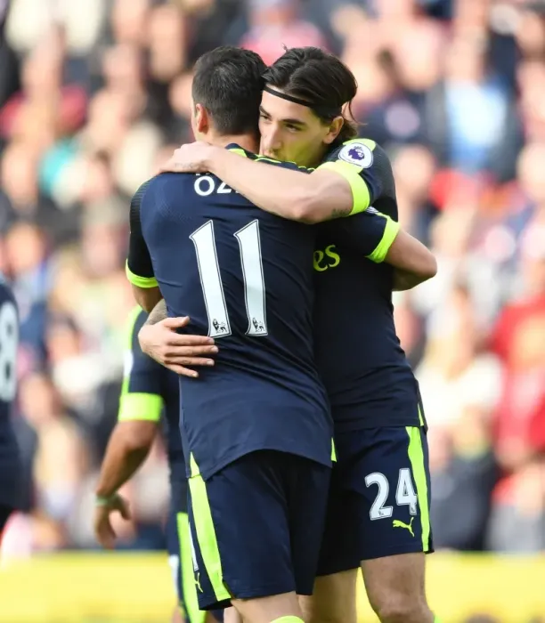 Framed Print : Arsenal's Unstoppable Duo: Ozil and Bellerin's Euphoric Goal Celebration vs Stoke City