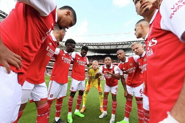 Arsenal's Unstoppable Force: The Huddle Before Battle Against Tottenham in the Premier League (2022-23)