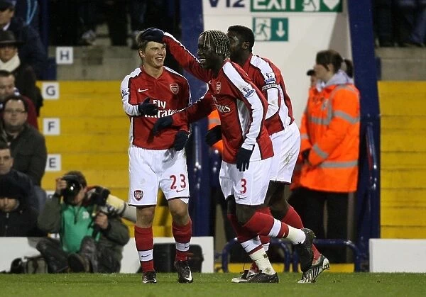 Arsenal's Unstoppable Moment: Kolo Toure, Bacary Sagna, and Andrey Arshavin Celebrate Goal Against West Bromwich Albion (3-1)
