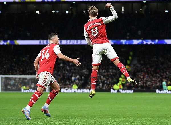 Arsenal's Unstoppable Partnership: Odegaard and Xhaka's Celebration of Winning Goal Against Tottenham (2022-23)