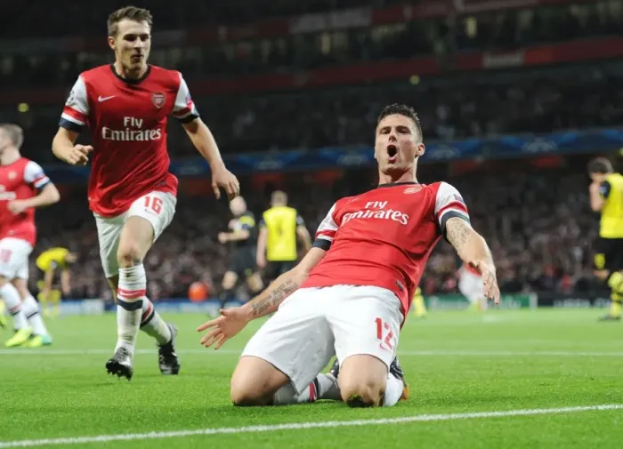 Framed Print : Arsenal's Unstoppable Partnership: Giroud and Ramsey's Goal Dance, 2013-14 UEFA Champions League