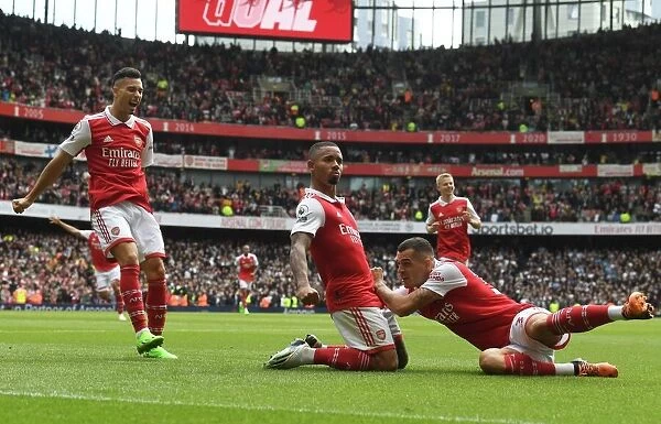 Arsenal's Unstoppable Trio: Jesus, Martinelli, and Xhaka's Goal Celebration in Arsenal's Triumph over Tottenham (2022-23 Premier League)