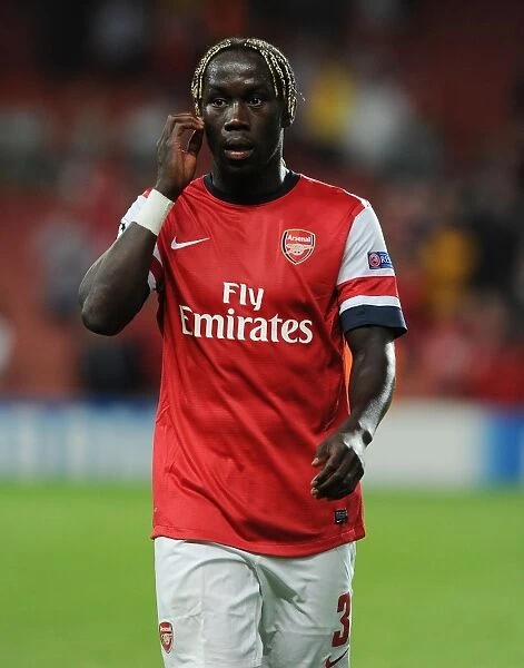 Arsenal's Unyielding Defender: Bacary Sagna in Action during the 2013-14 UEFA Champions League Play-offs vs Fenerbahce