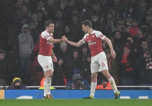 Arsenal's Unyielding Defensive Duo: Sokratis and Koscielny in Action against Manchester United (2018-19)