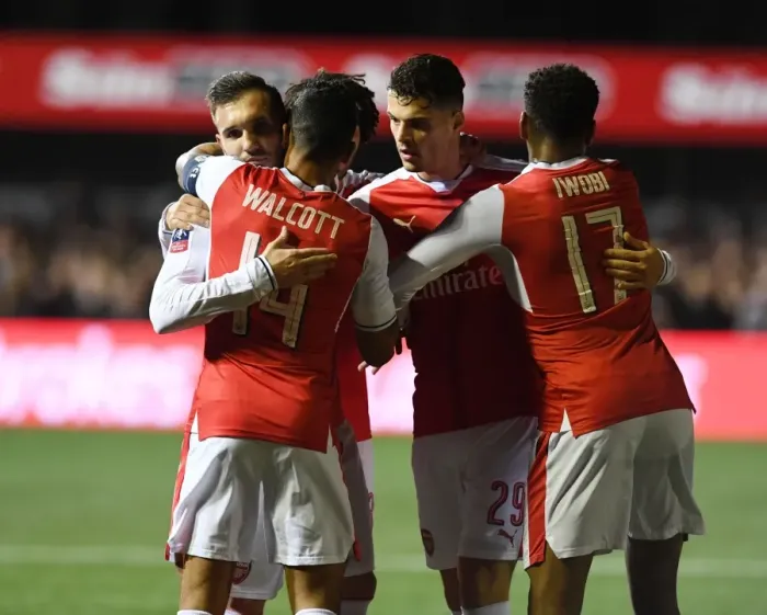 Framed Print : Arsenal's Upset Victory over Sutton United in FA Cup: Perez, Walcott, Xhaka, and Iwobi Celebrate Framed Print : Arsenal's Upset Victory over Sutton United in FA Cup: Perez, Walcott, Xhaka, and Iwobi Celebrate