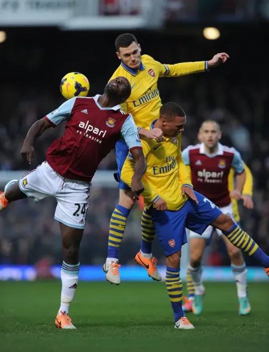 Framed Print : Arsenal's Vermaelen and Gibbs Clash with West Ham's Cole in Premier League Battle