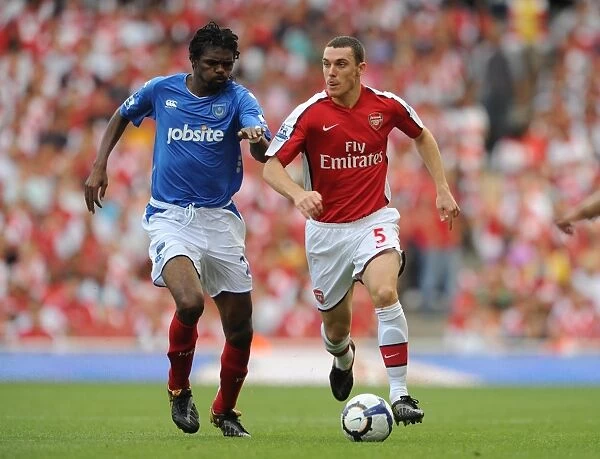 Arsenal's Vermaelen and Kanu: Celebrating Arsenal's 4-1 Victory Over Portsmouth at Emirates Stadium (2009)