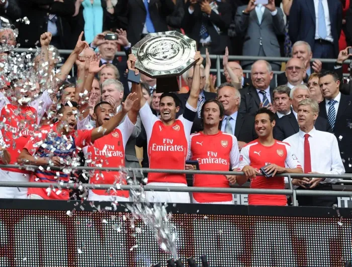Framed Print : Arsenal's Victory Celebration: Mikel Arteta, Rosicky, Cazorla, Oxlade-Chamberlain, and Wenger at the FA Community Shield 2014 / 15