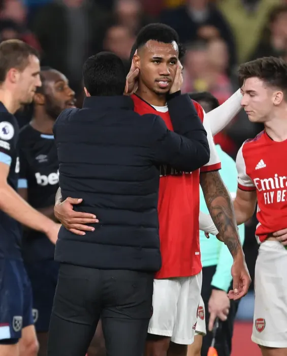 Framed Print : Arsenal's Victory: Mikel Arteta Consoles Gabriel after Arsenal v West Ham United (2021-22)